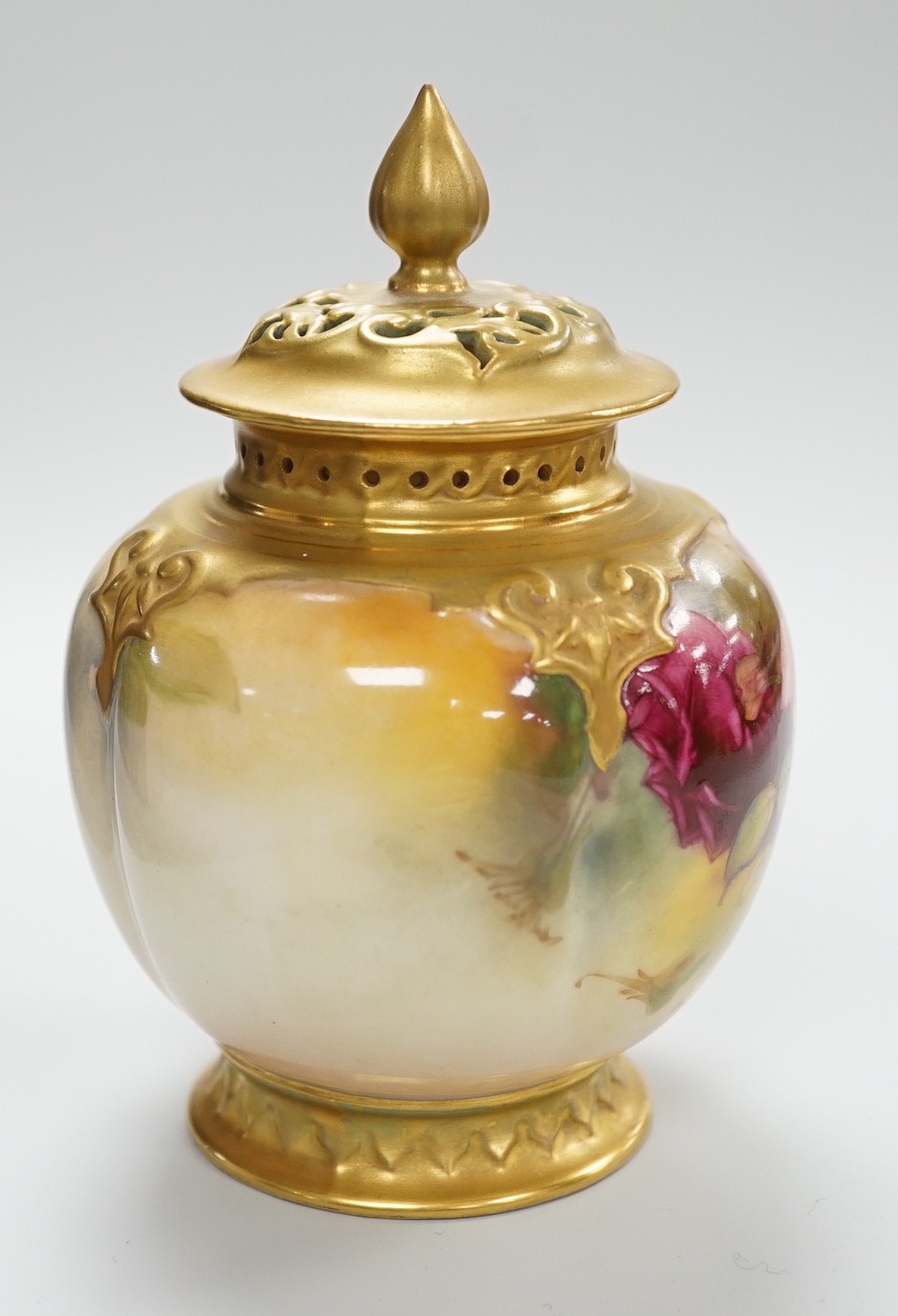 A Royal Worcester pink rose painted pot pourri vase and cover. 14cm tall